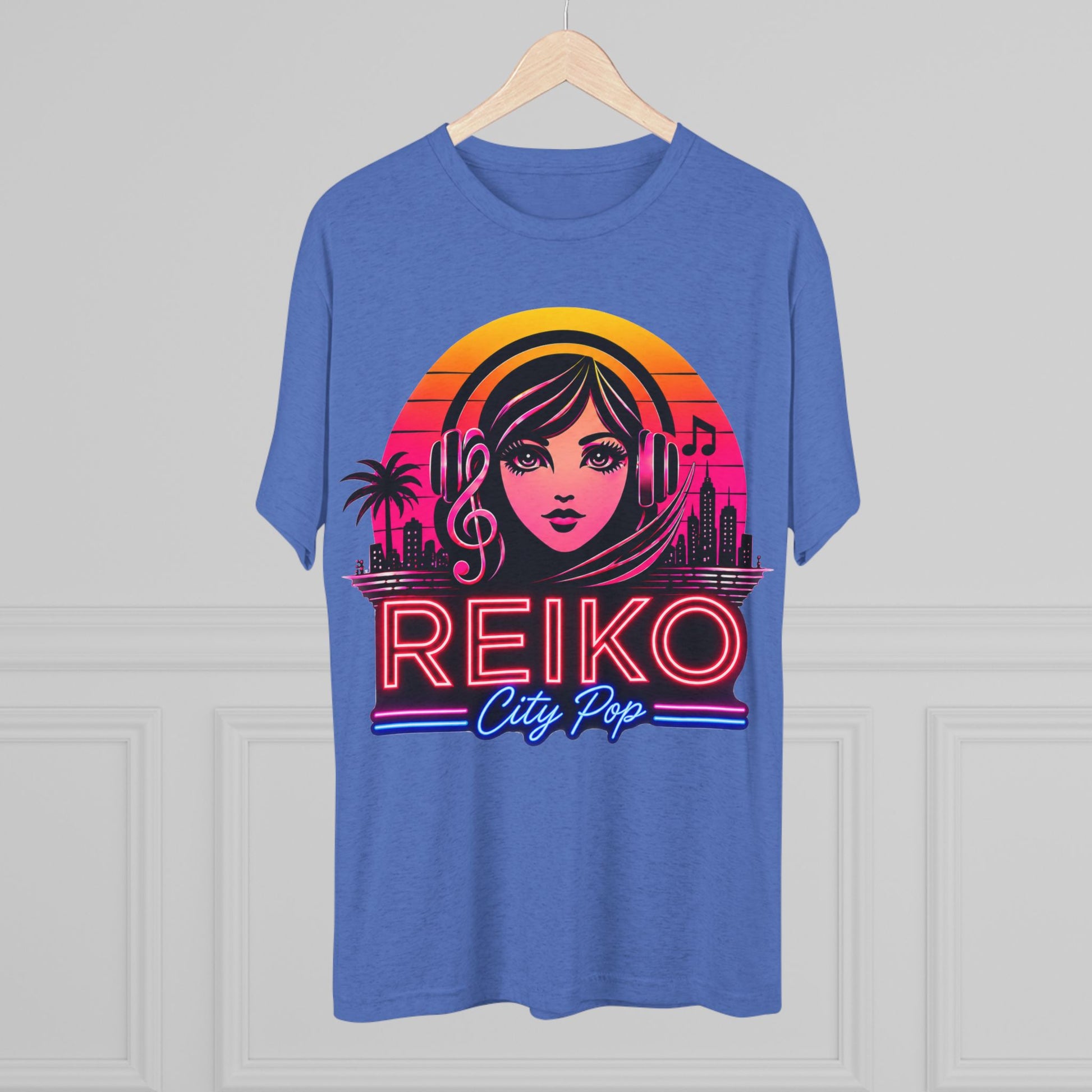 Front view of the Reiko Takahashi City Pop Sunset Logo Tee in Royal Blue, printed on a premium Next Level tri-blend T-shirt and displayed on a wooden hanger. Features retro neon artwork inspired by the song "Sunset Road."